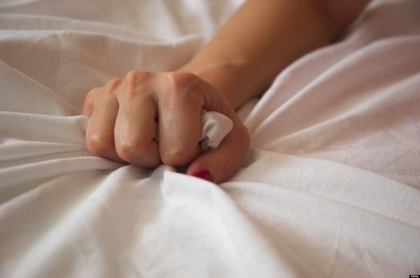 Woman s Hand Squeezing Bed Sheet