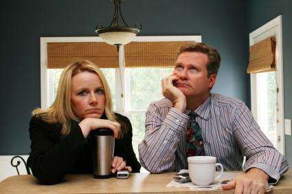 A couple eat breakfast before work