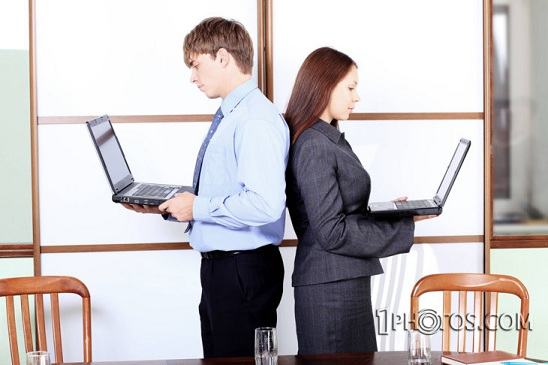 couple with laptops